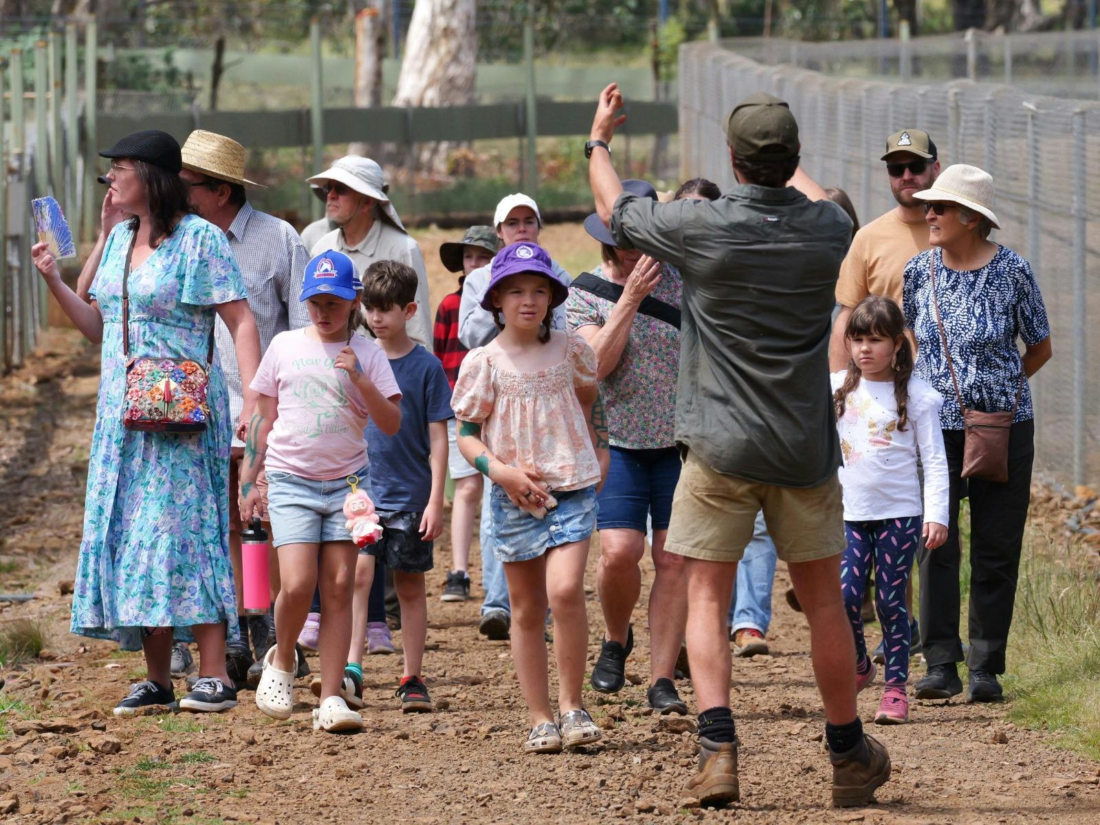 Wildlife Ranger, Nero Rochet, leading a group and conducting a talk with a group of visitors.
