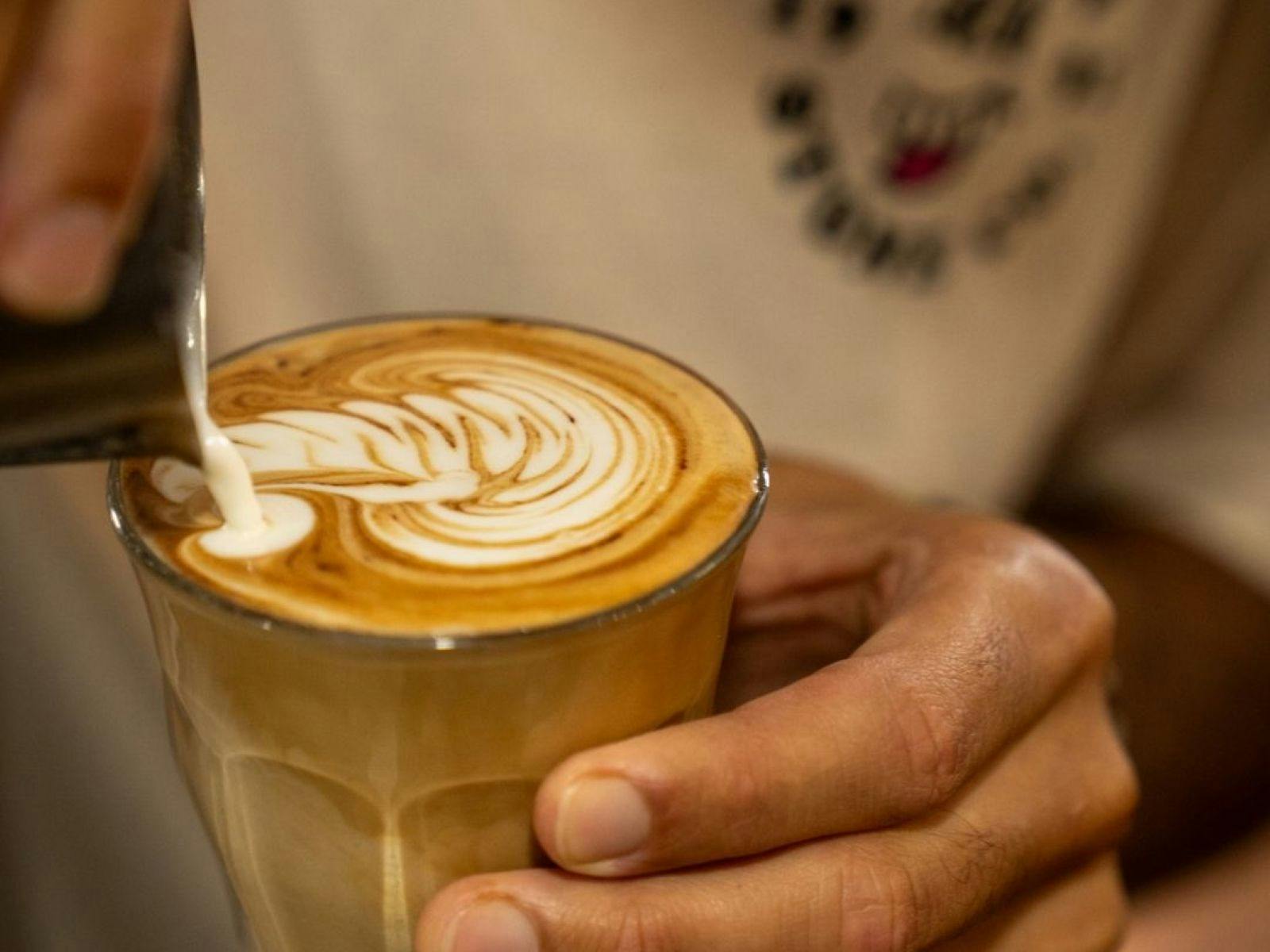 man pouring coffee