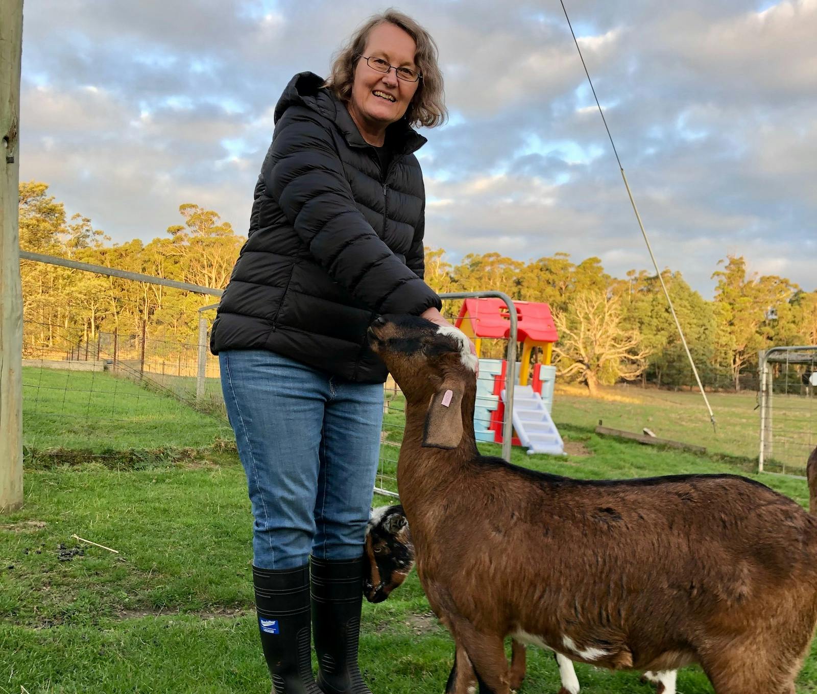 Lady patting goat