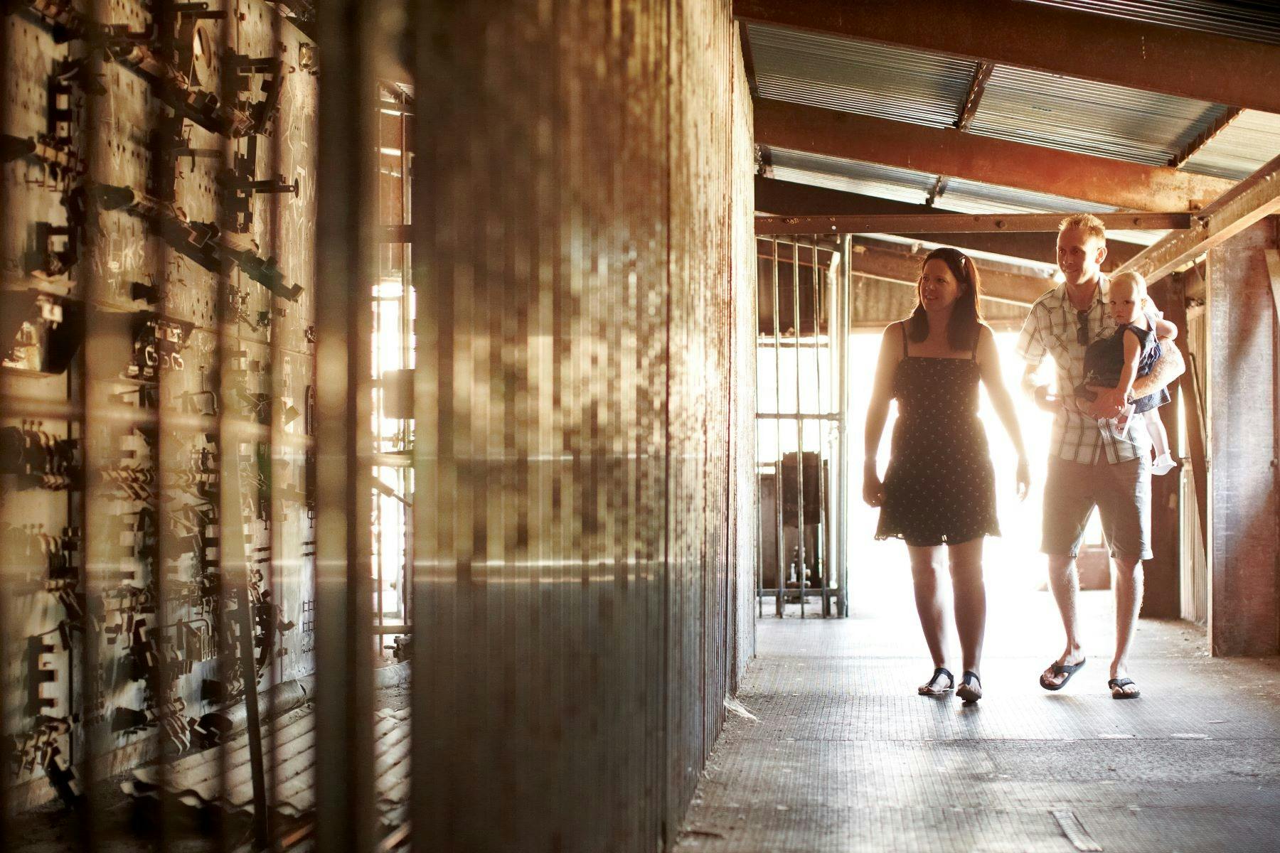 People on the Eldorado Dredge looking at the machinery
