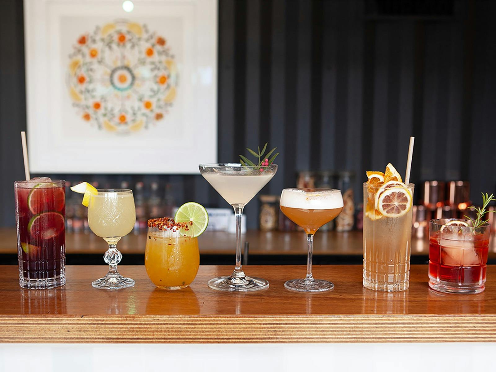 Cocktails lined up on a bar