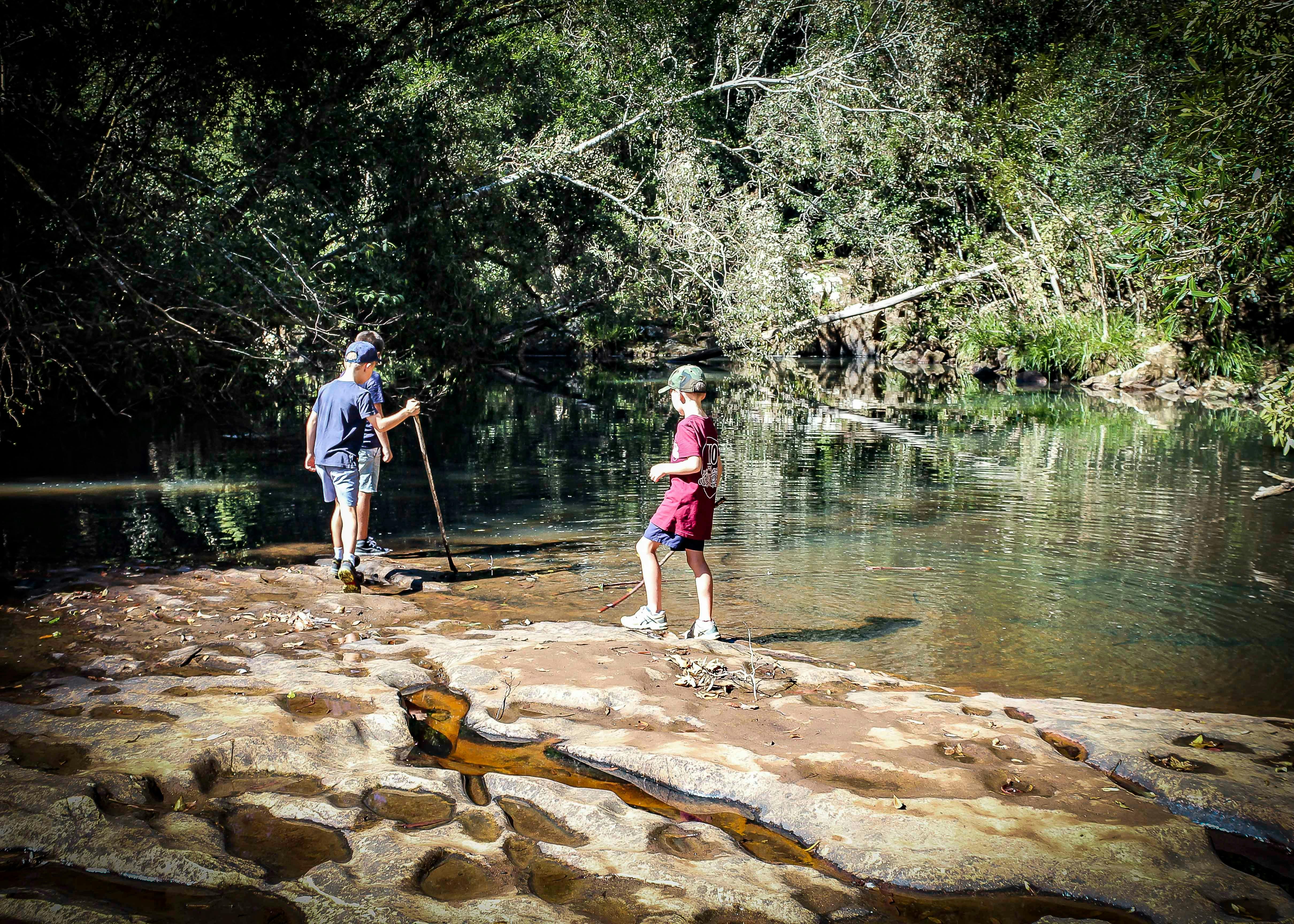 Two children on the banks of Upsalls Creek
