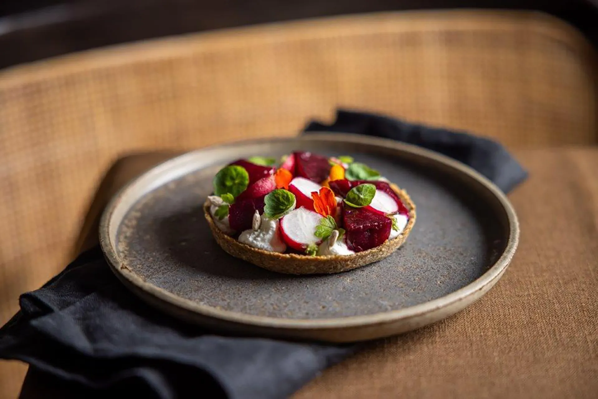 A plate of sunflower tart on a table