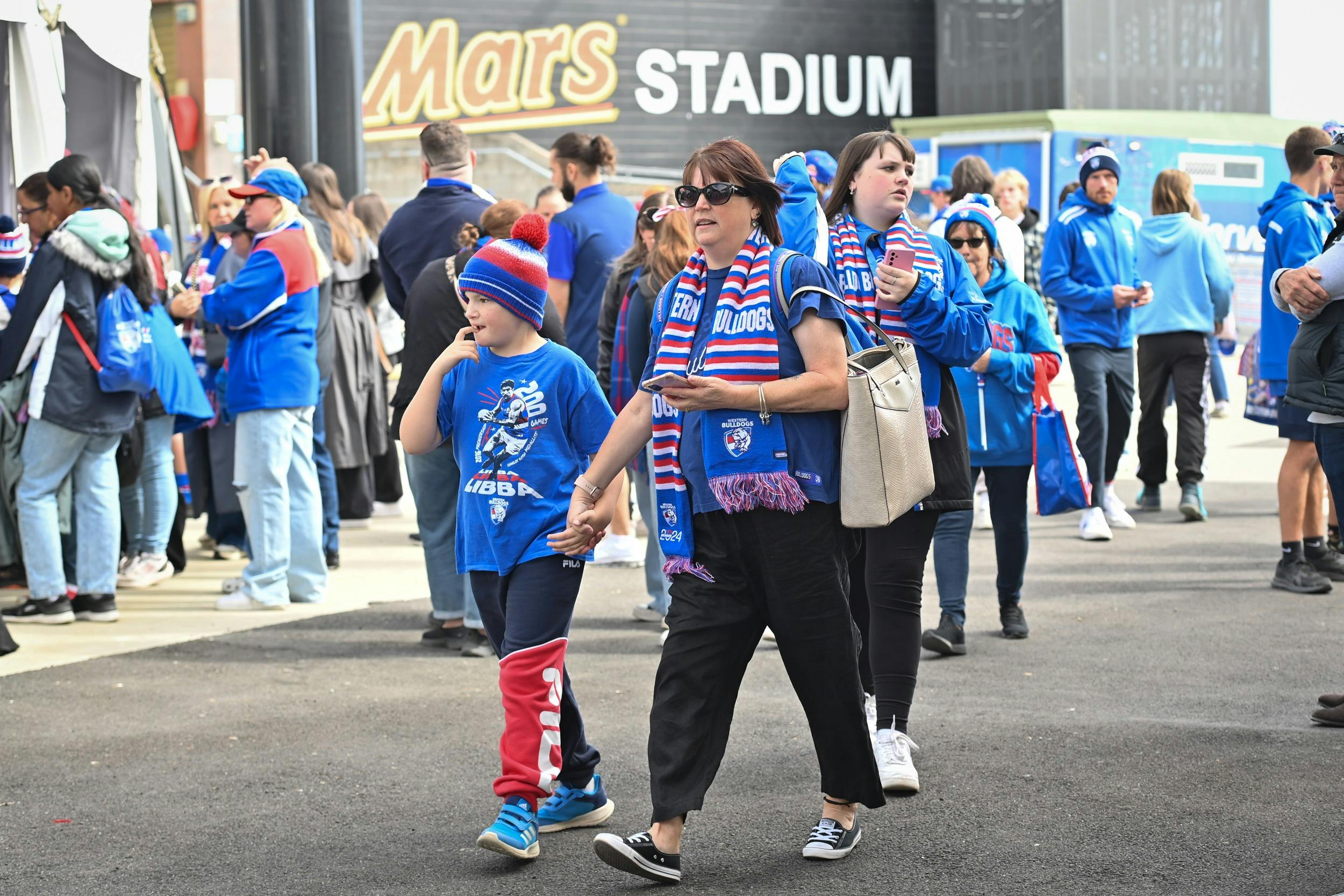 Crowds in Western Bulldogs merchandise.