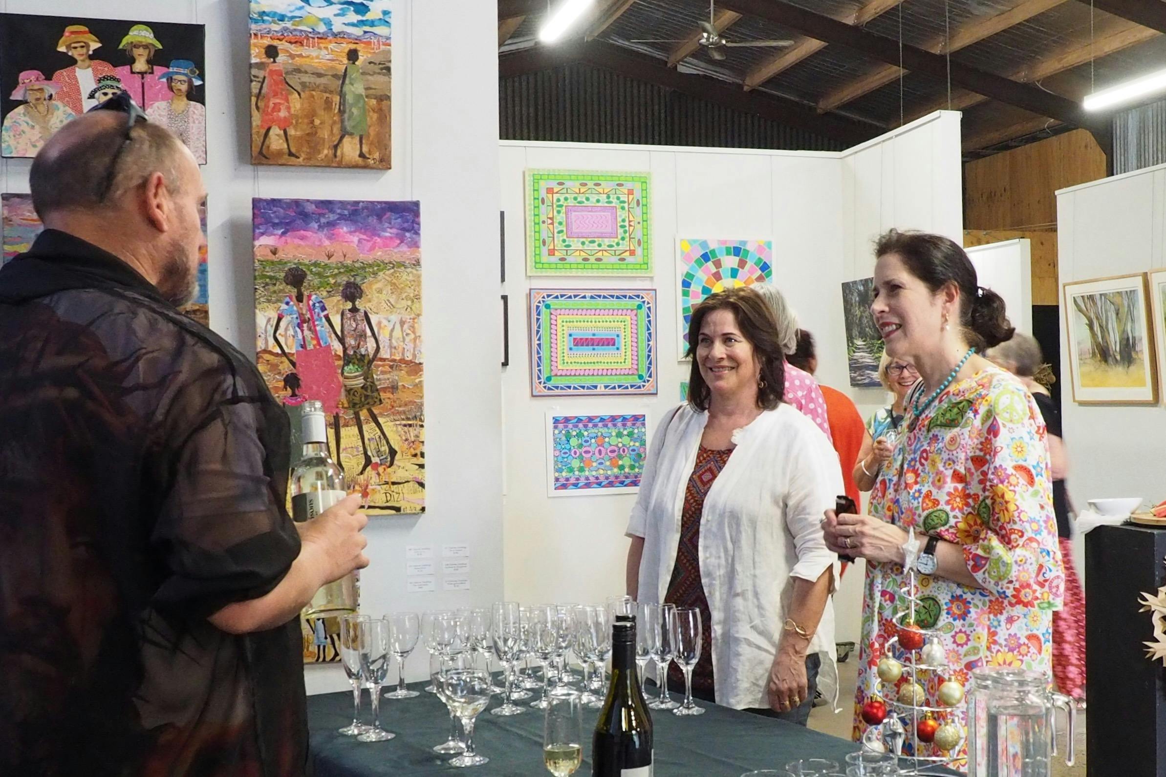 Guests mingle over drinks and nibbles