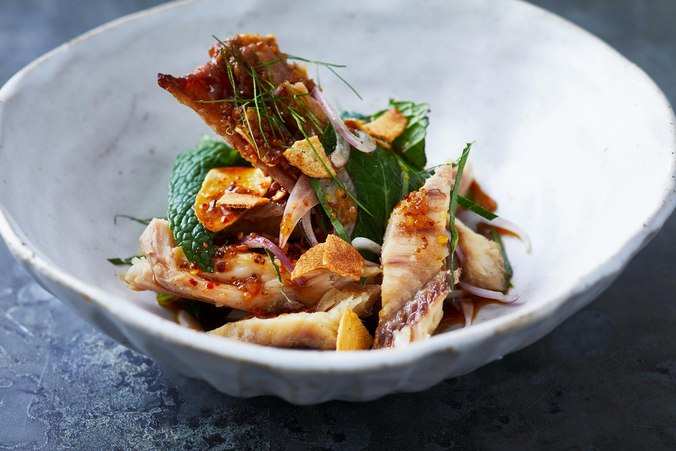 Enjoy exquisite Thai cuisine crafted by our award-winning chef. Grilled catfish salad. Book now.