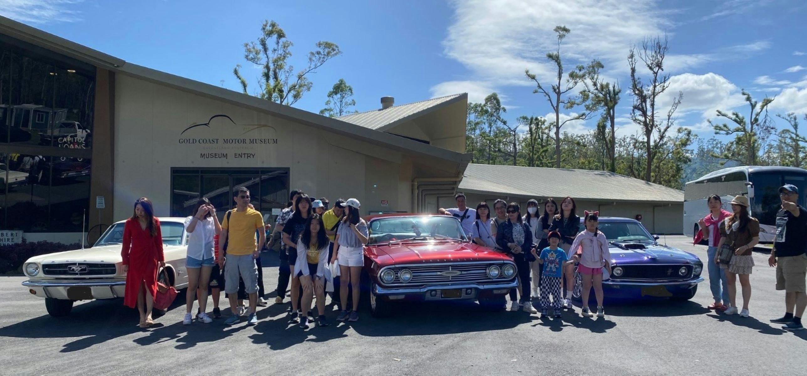group enjoying a classic car ride
