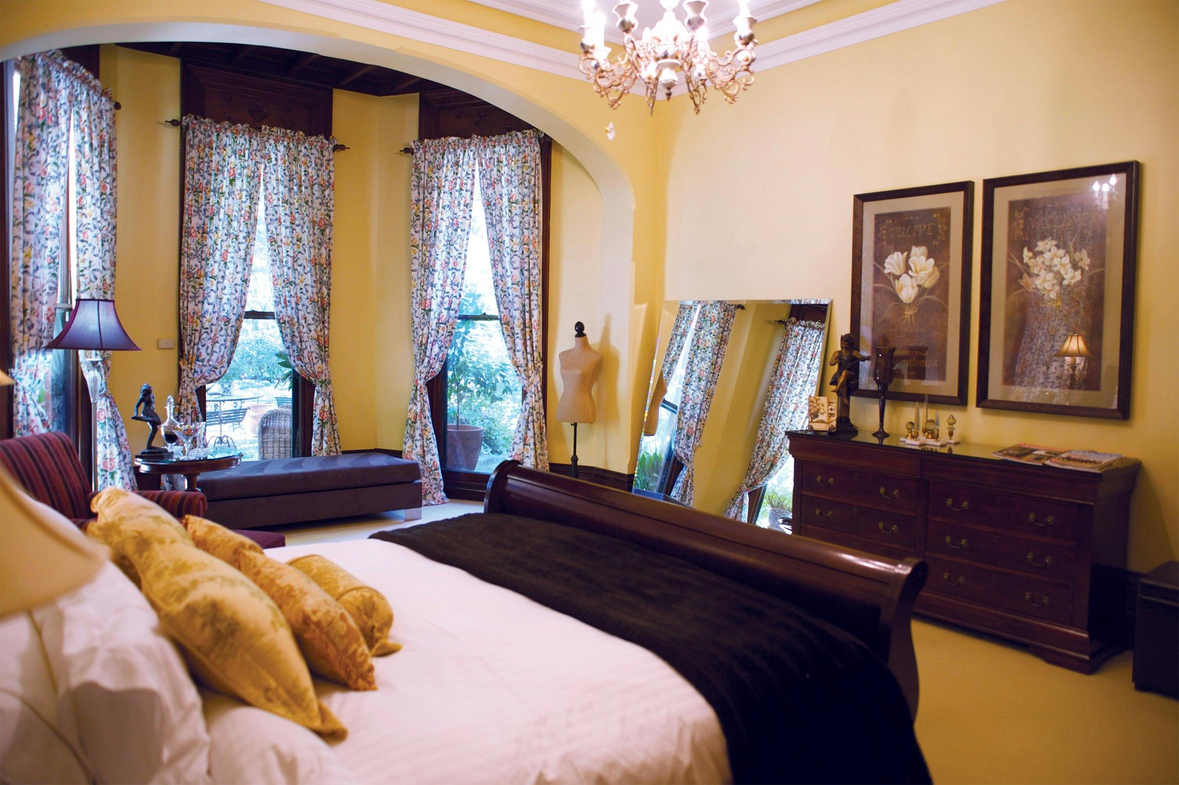 Grand Botannica room with superking bed dressed with luxurious linen overlooking the parkland garden