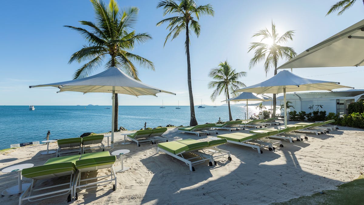 coral sea resort lounge chairs on the beach