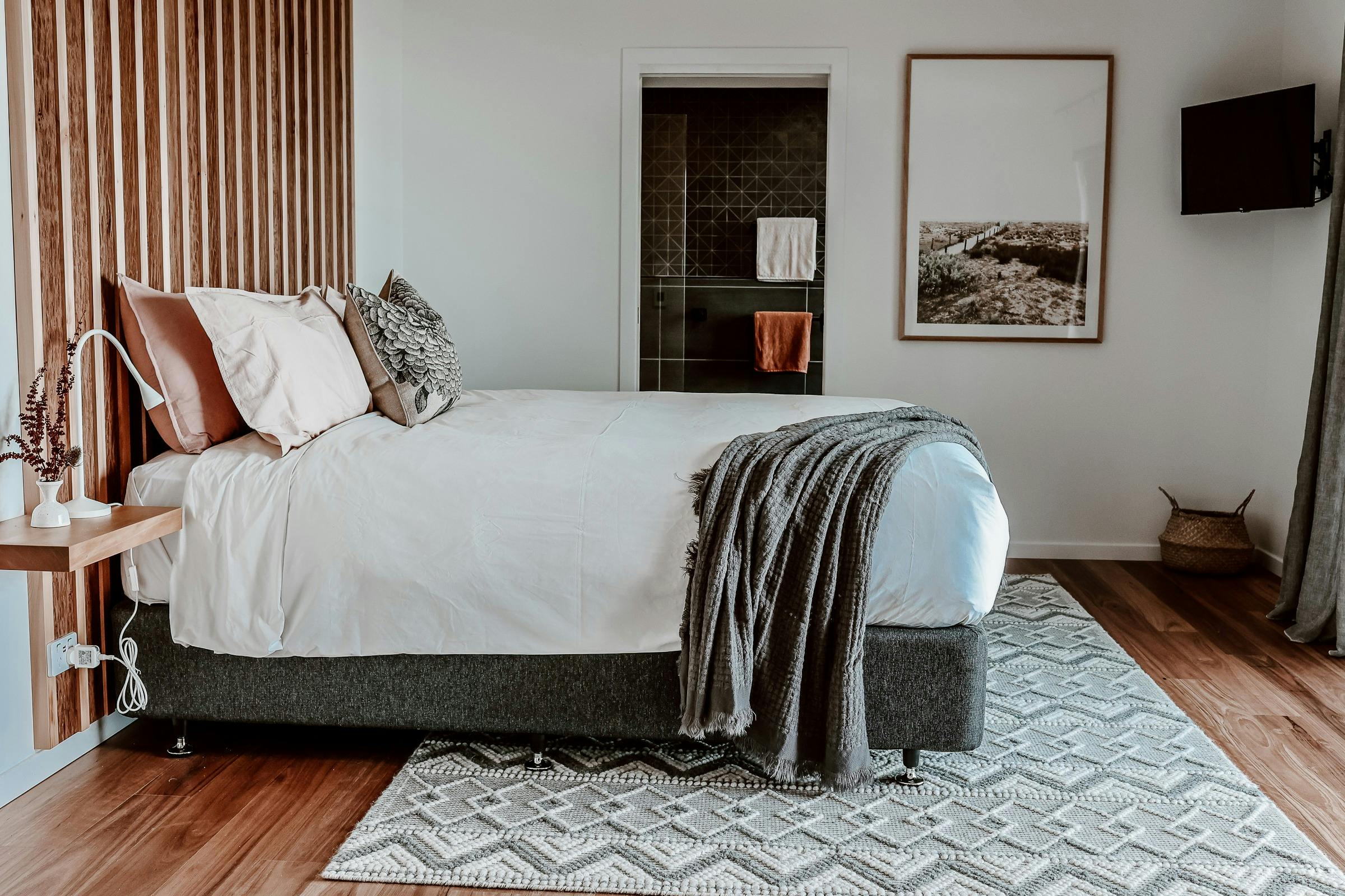 king sized bed over looks Sandpiper beach, private ensuite