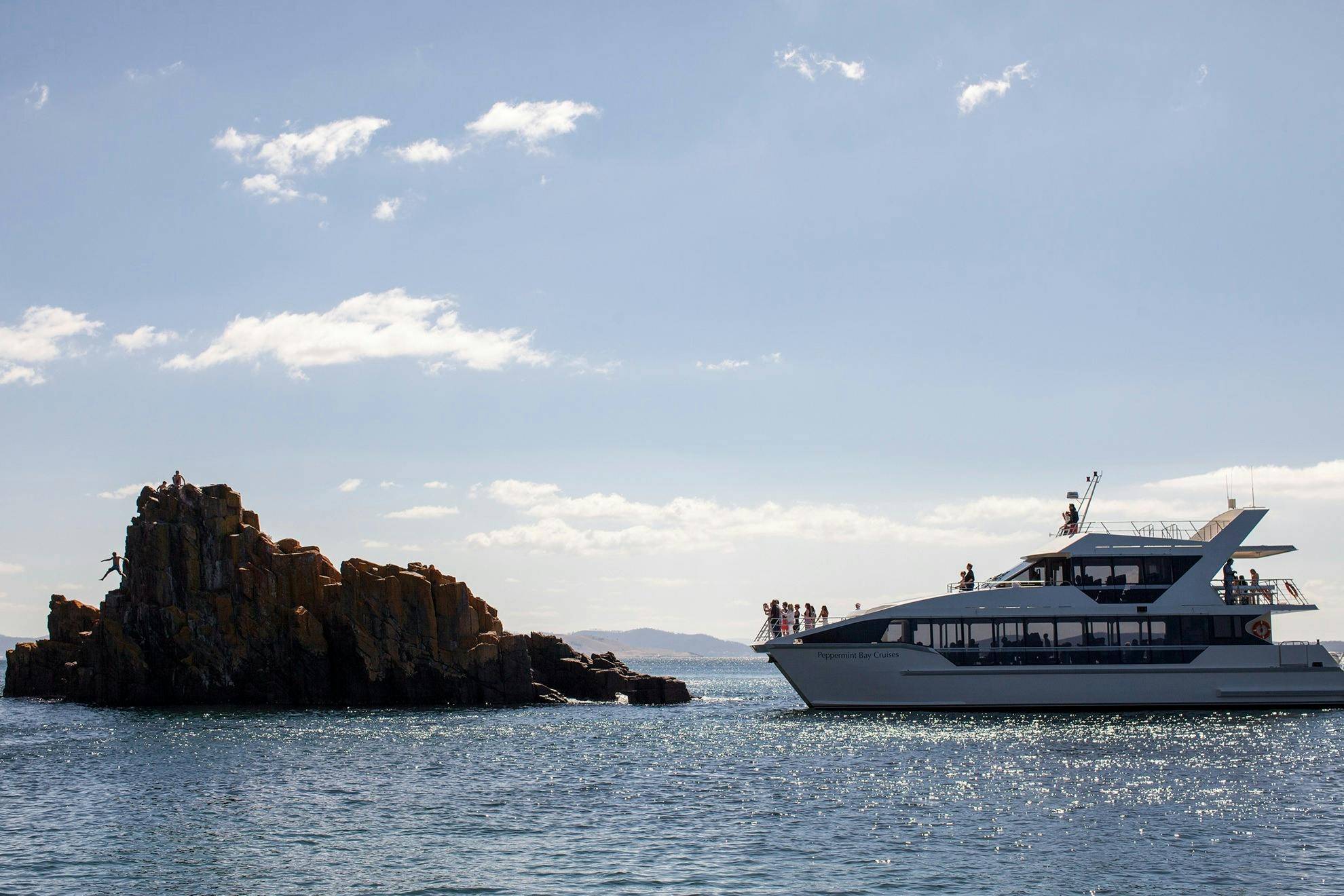 Peppermint Bay catamaran cruising around rock formations