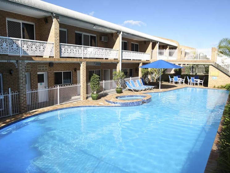Motel rooms overlook pool