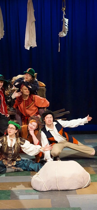 people pose portraying Elizabethan era entertainers