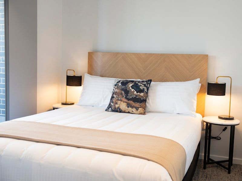 Studio-One-Bedroom-Queen-Bed-Two-Lamps-Side-Tables