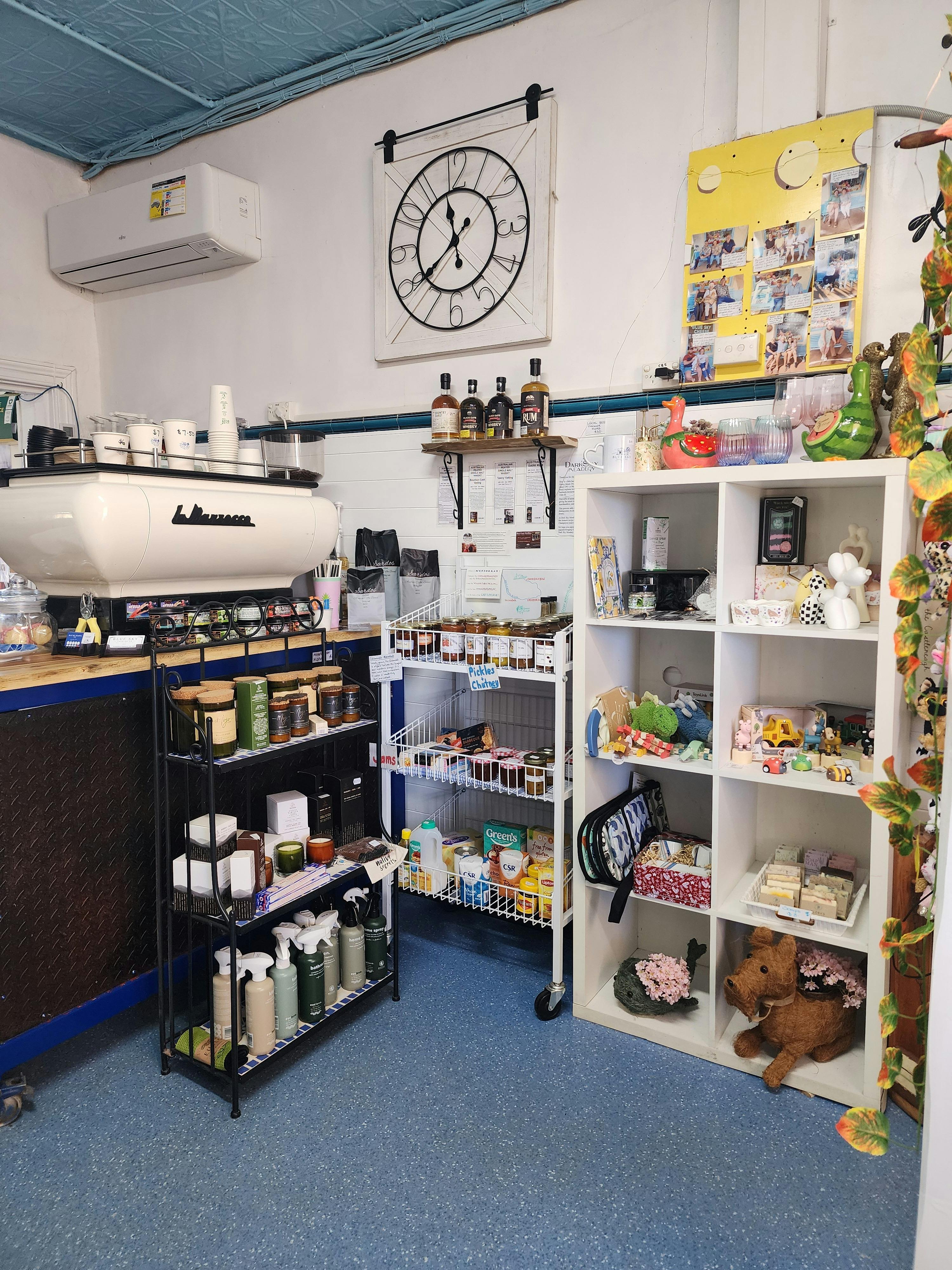 Inside Blue Sky Trading Co. showing coffee machine and some of the products available.