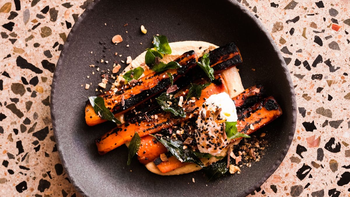 Blackened carrots, pumpkin hummus, date molasses, sweet dukkah