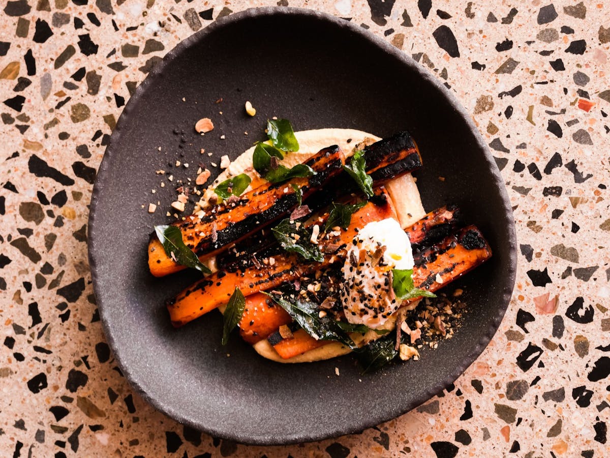 Blackened carrots, pumpkin hummus, date molasses, sweet dukkah