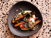 Blackened carrots, pumpkin hummus, date molasses, sweet dukkah