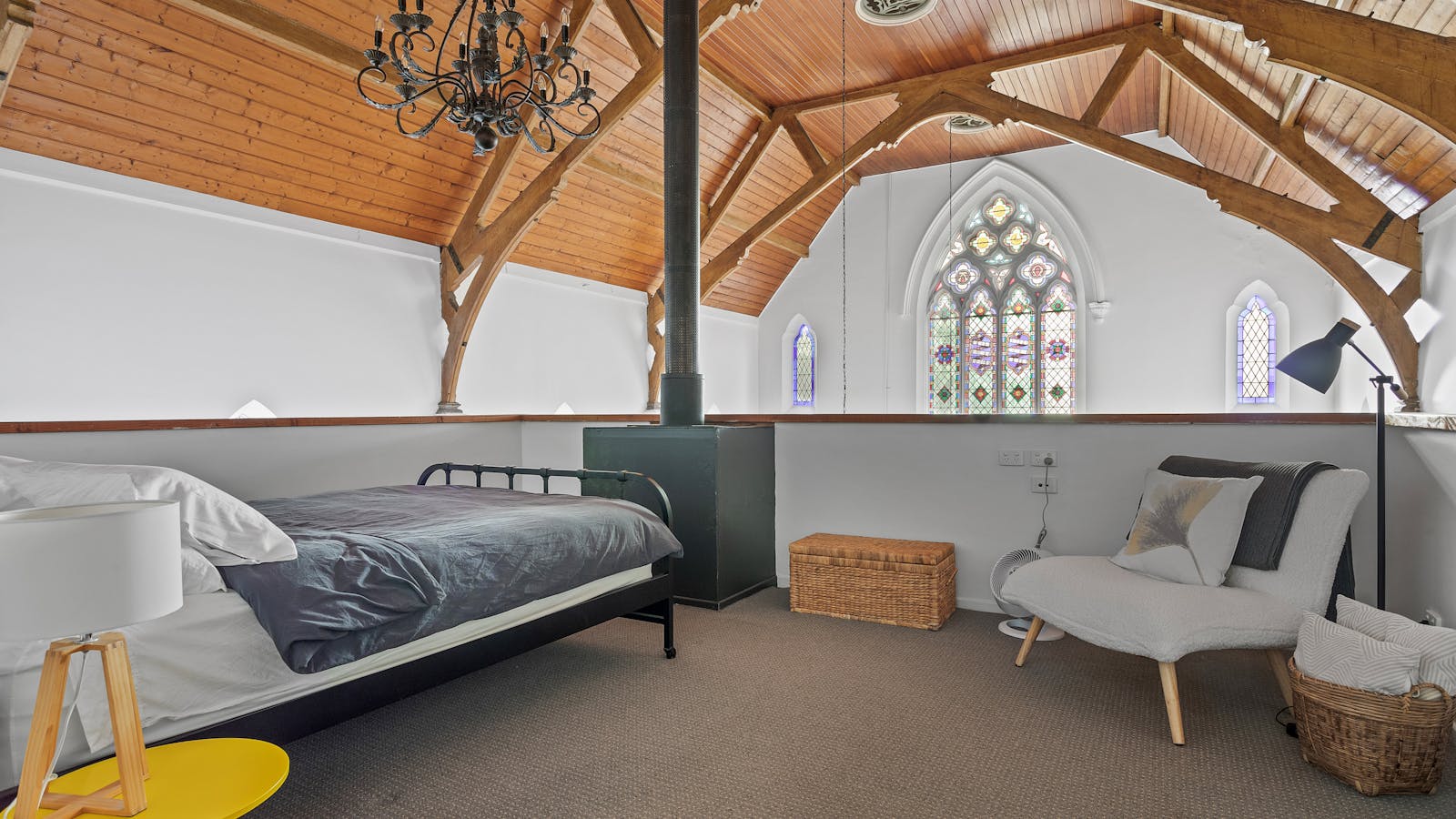 Mezzanine bedroom with queen bed and separate single bed area