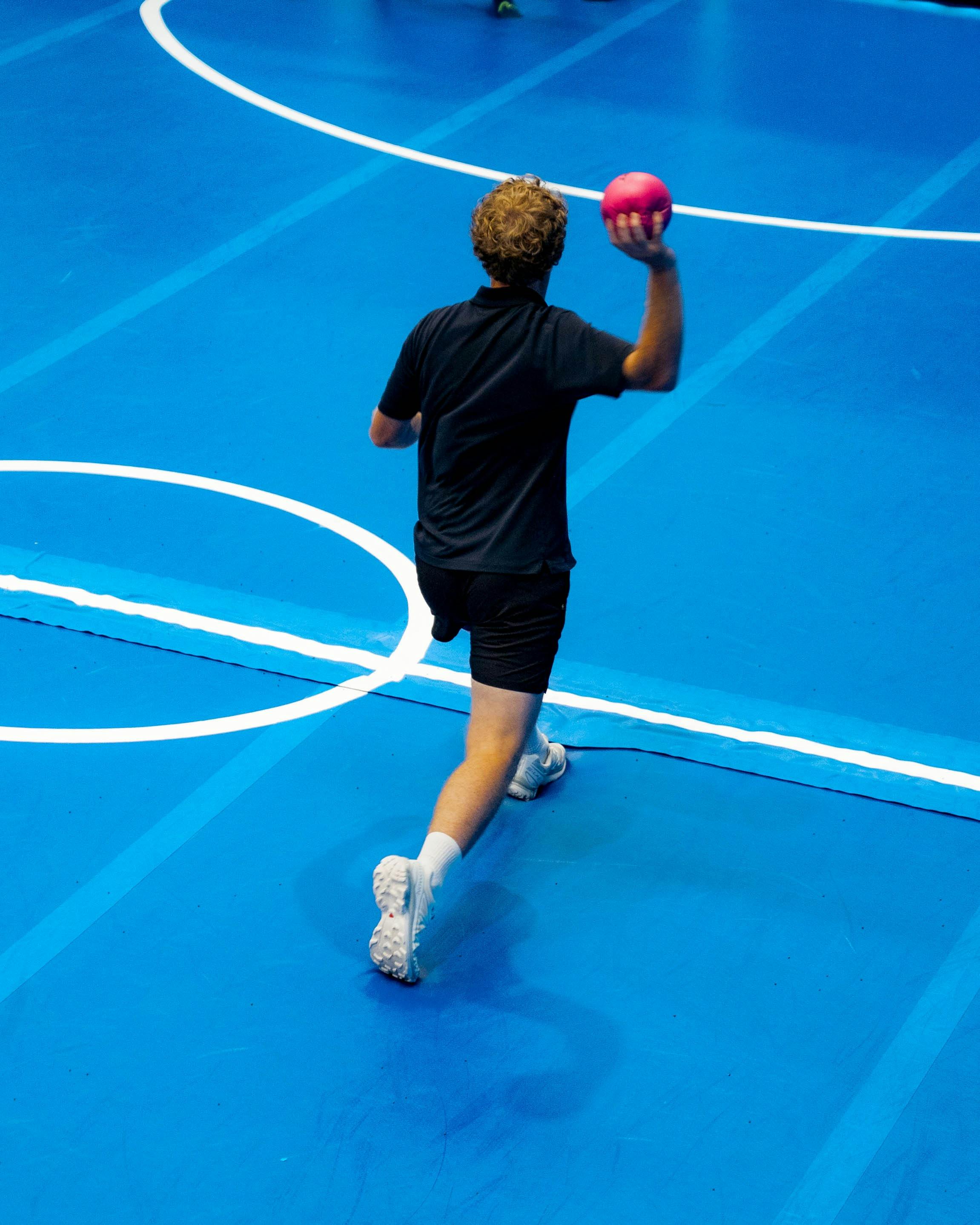 Person on Airtrack throwing dodgeball
