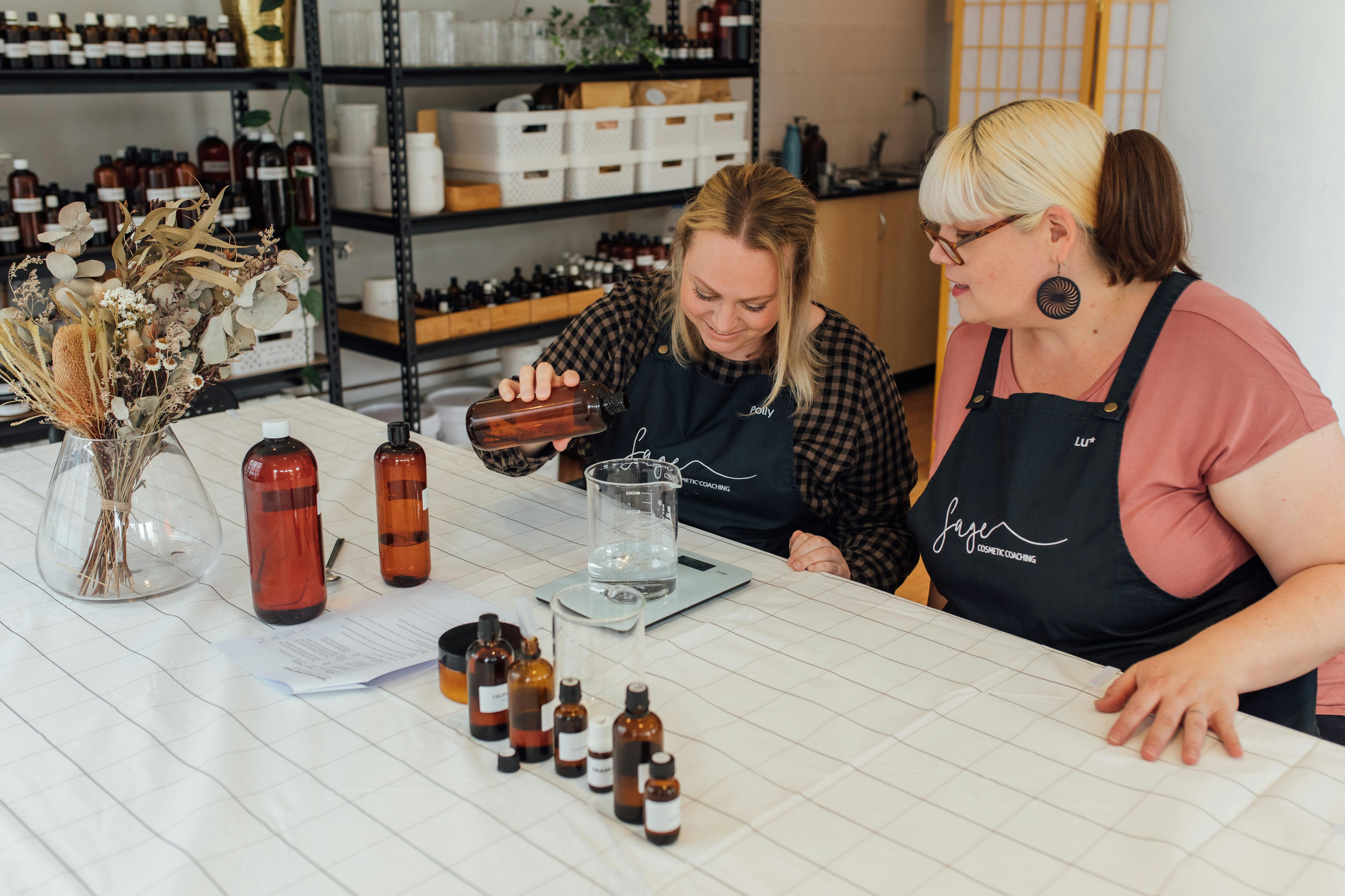 two women making skincare in the Sage Studio
