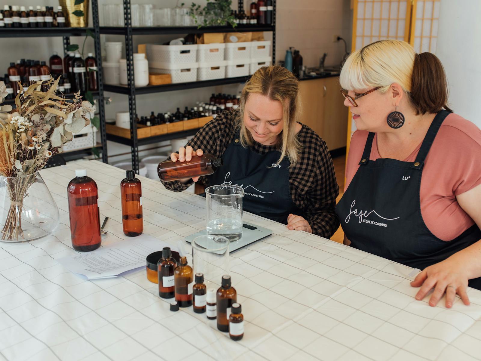 two women making skincare in the Sage Studio