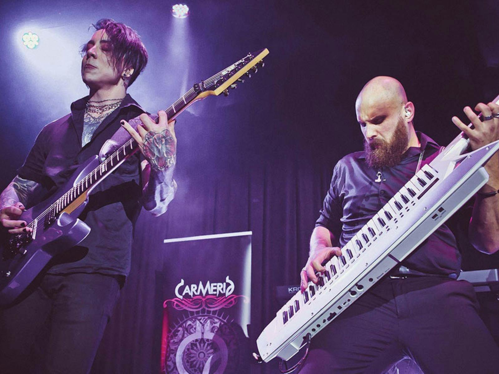 Man playing guitar and man playing electric piano
