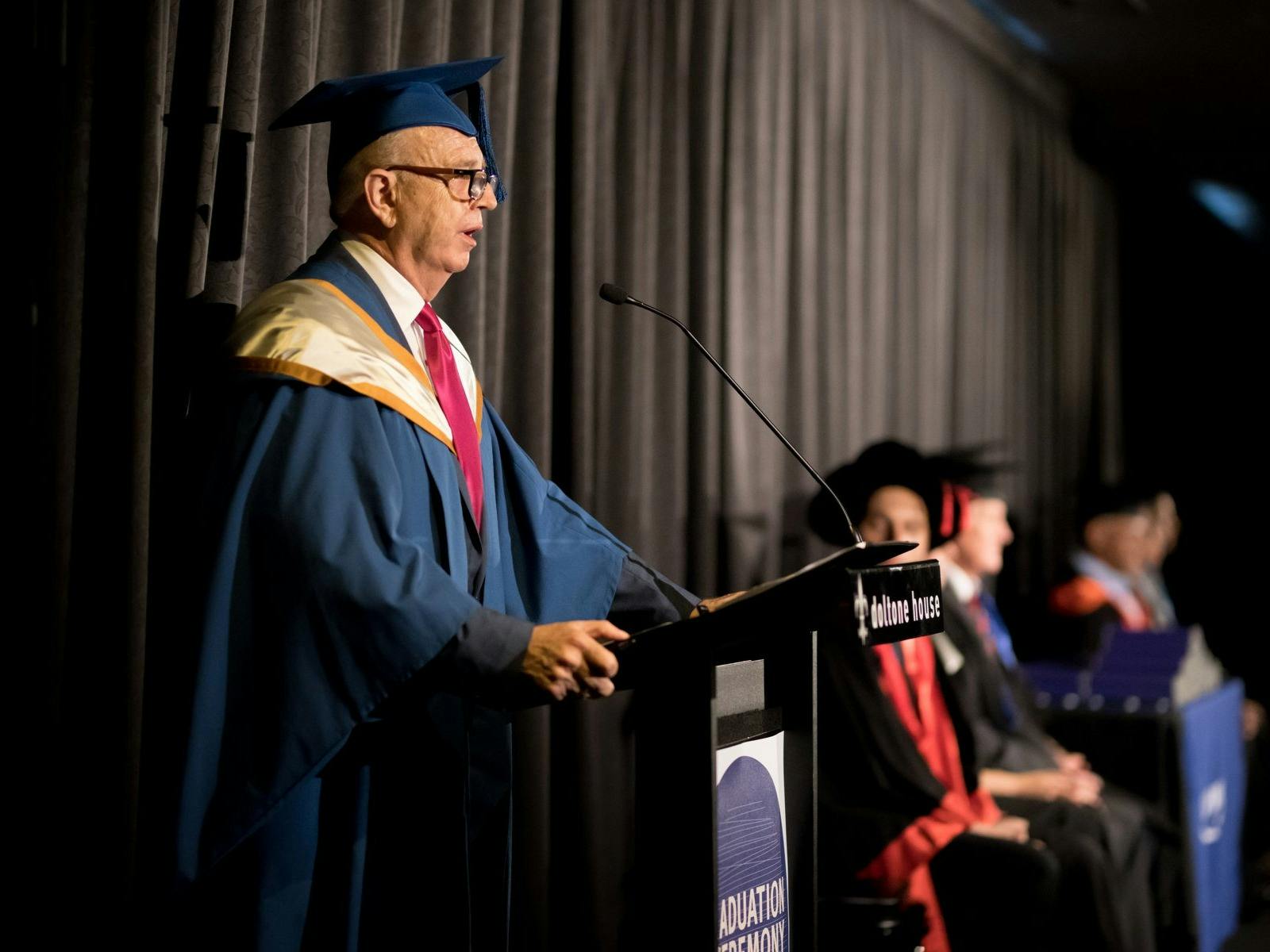 Graduate speaking at a formal event at Doltone House Sylvania Waters