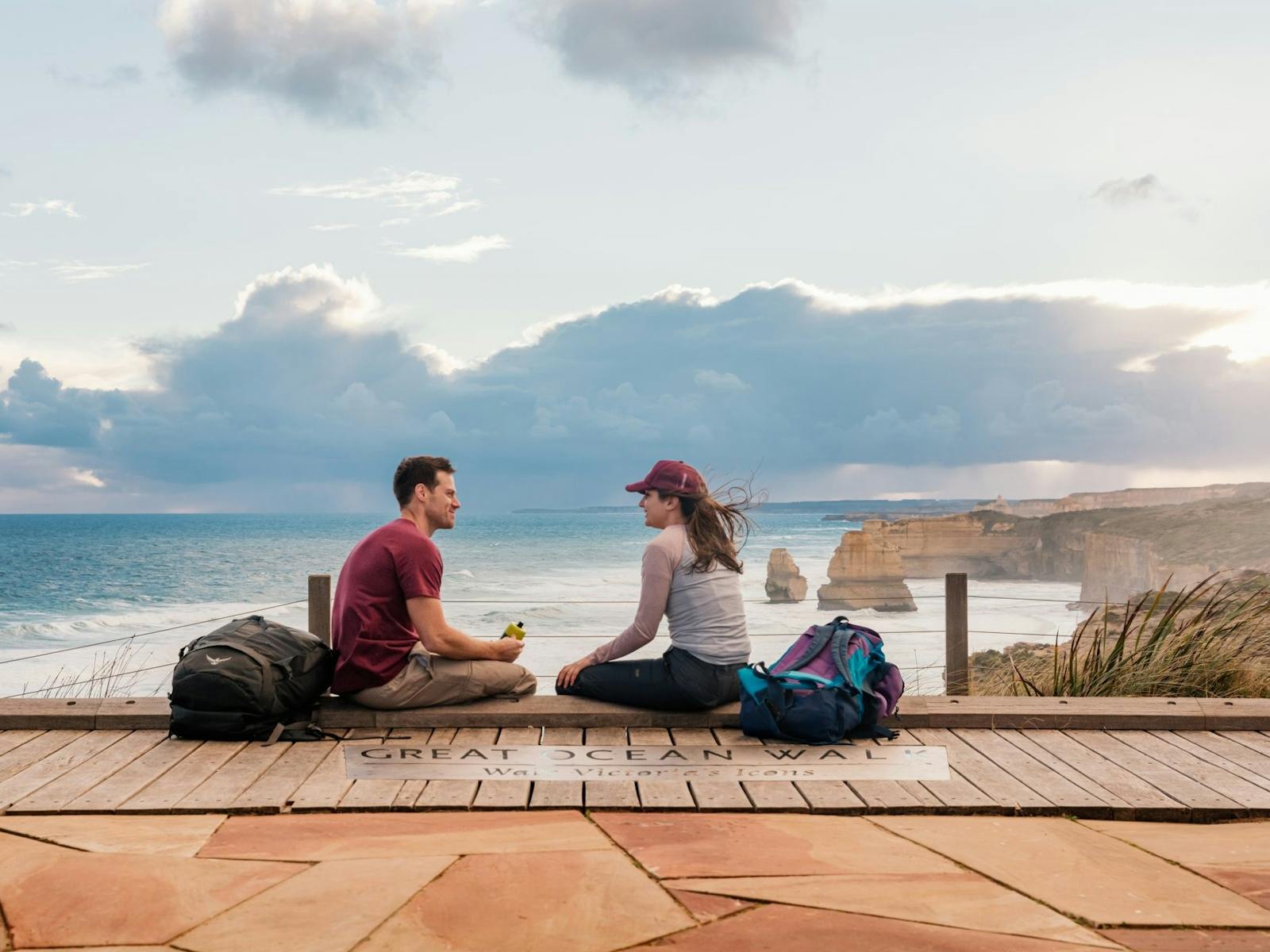 Two people sitting at the end of the Great Ocean Walk