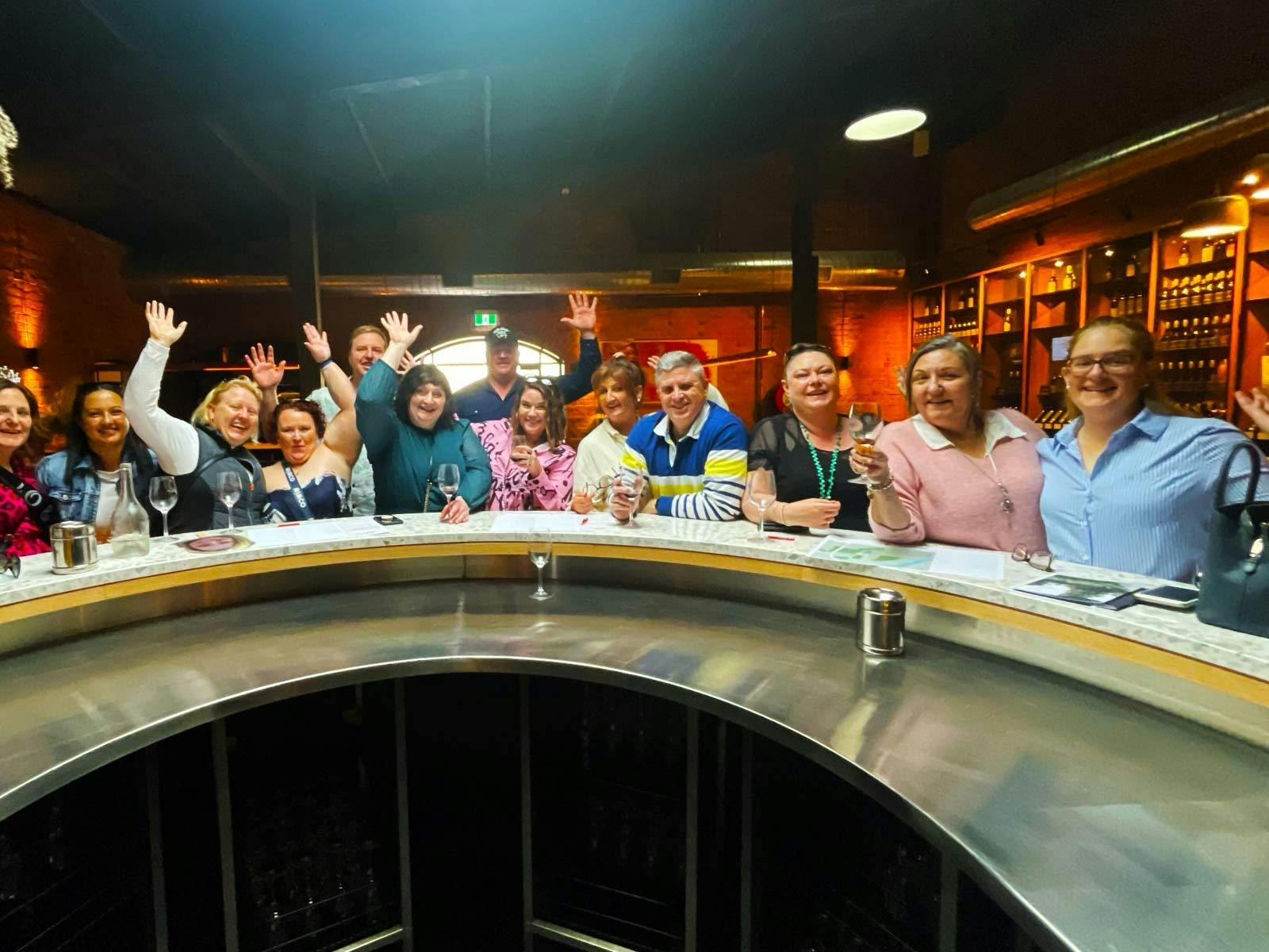 Smiling people tasting wine in a Rutherglen cellar door