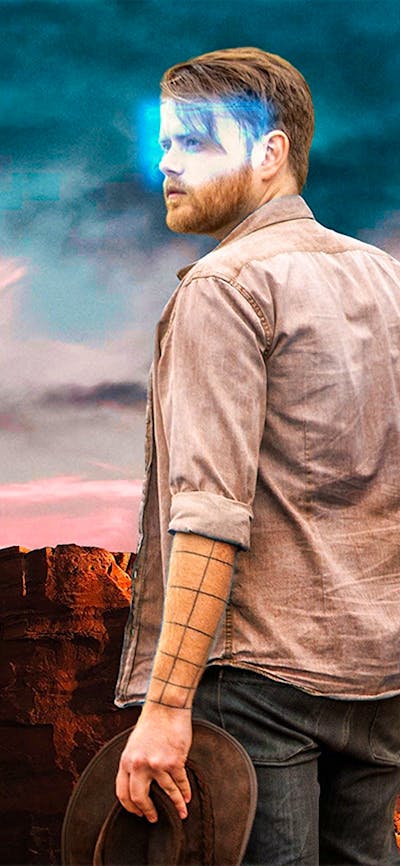 Man with a glowing VR headset looking at the ruins at Petra in an escape room