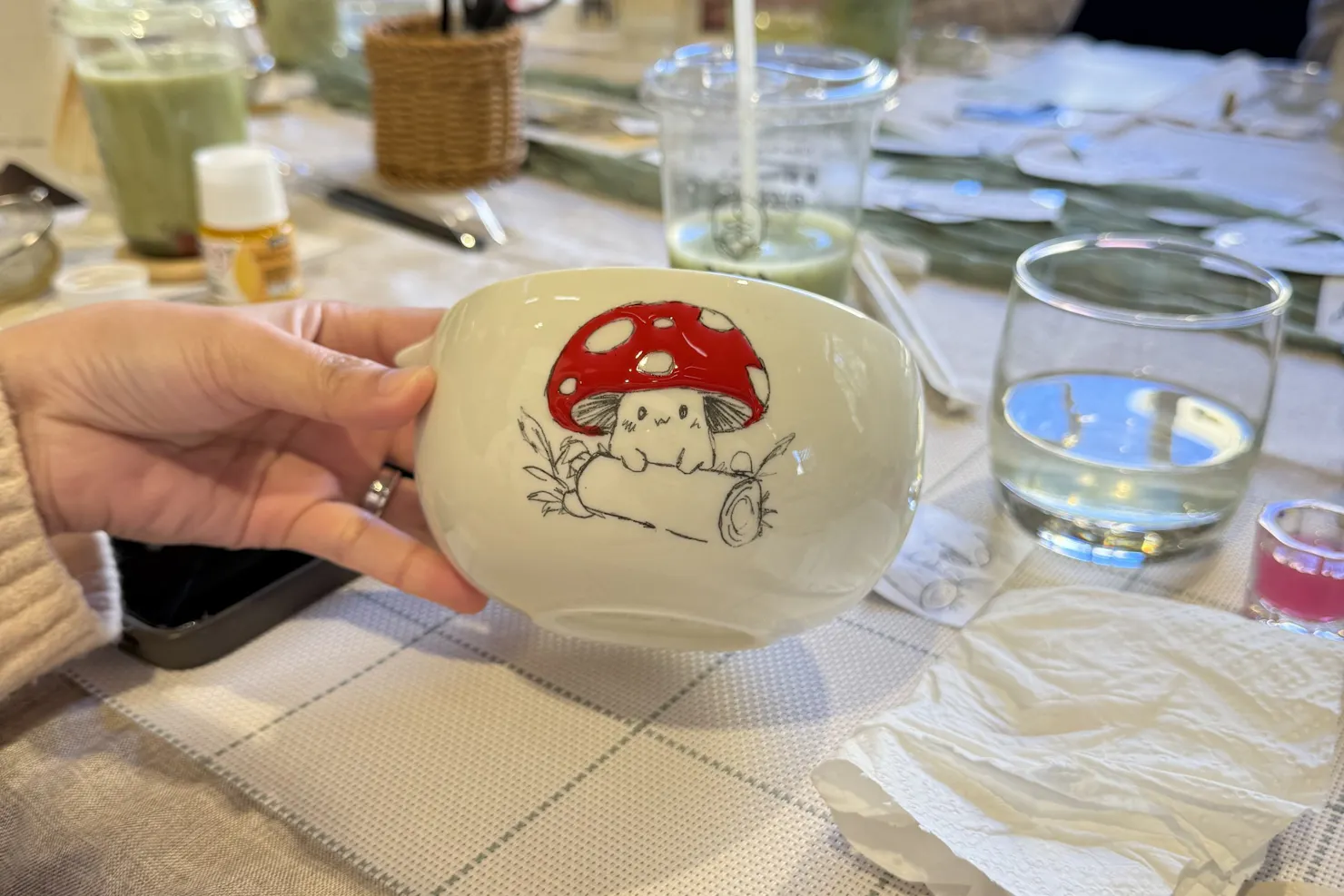 Guests painting ceramics and whisking Japanese matcha at a NOA Matcha workshop
