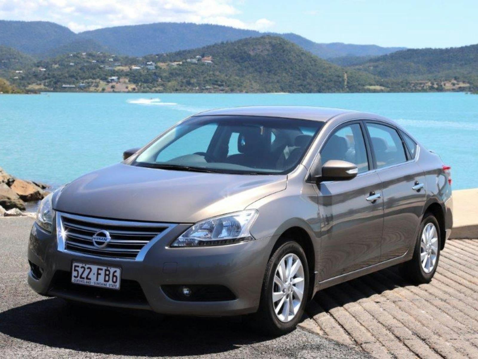 Heart of Reef Car for rent in front of Airlie Beach Background