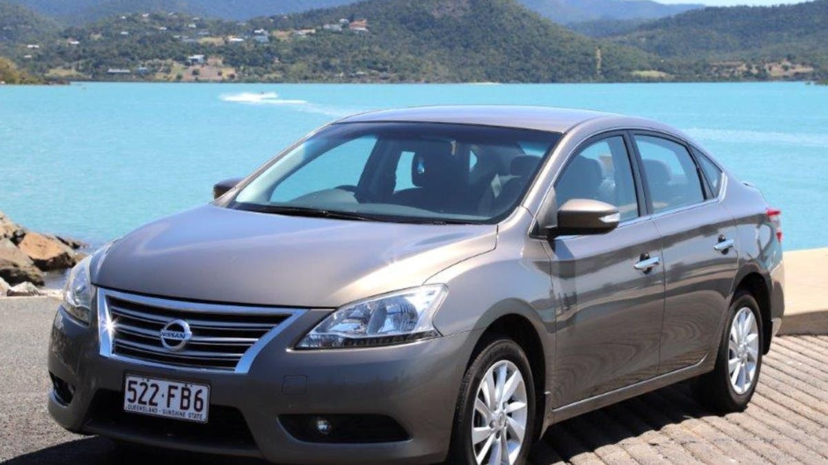 Heart of Reef Car for rent in front of Airlie Beach Background