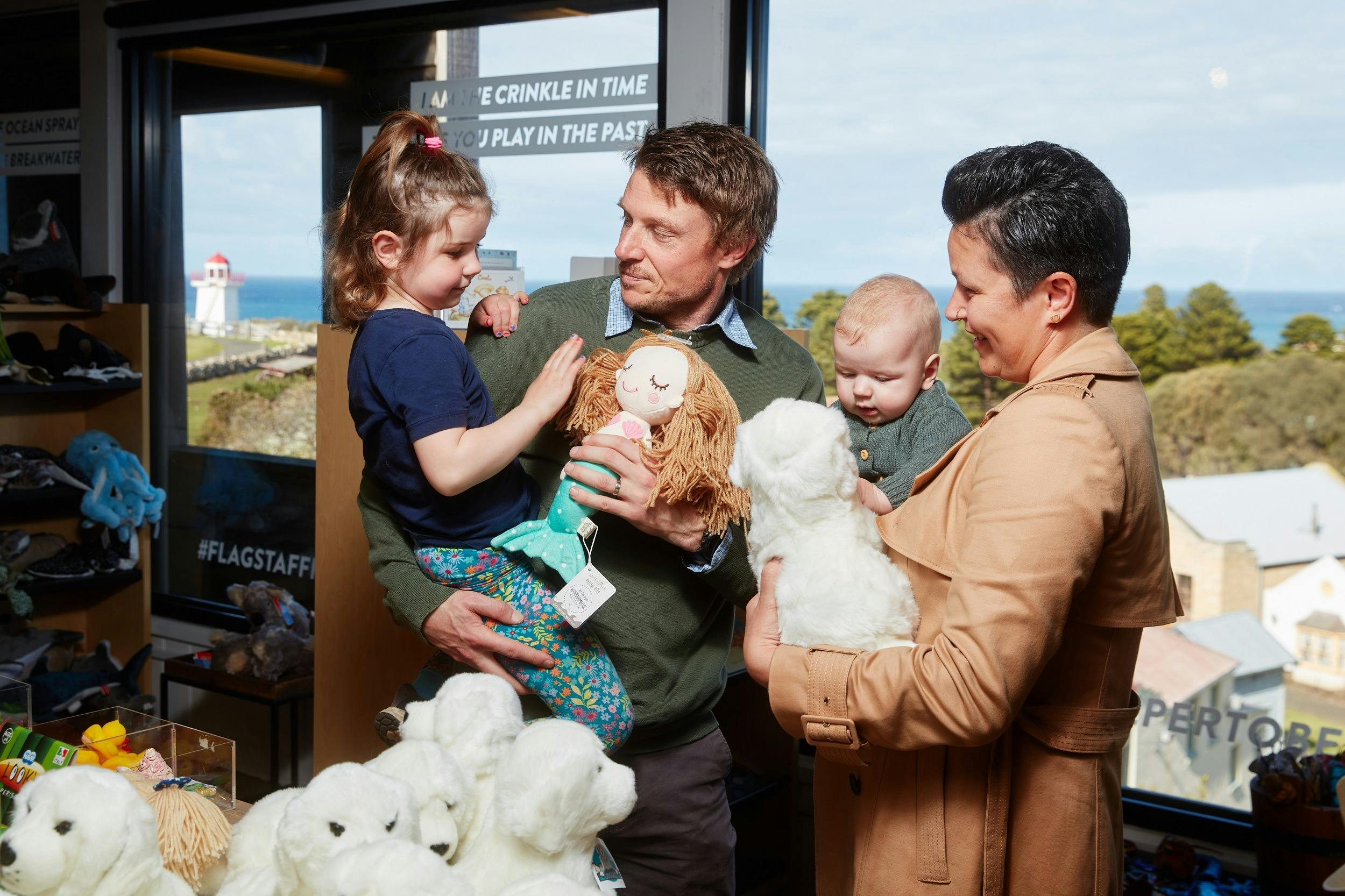 Family looking at plush toys