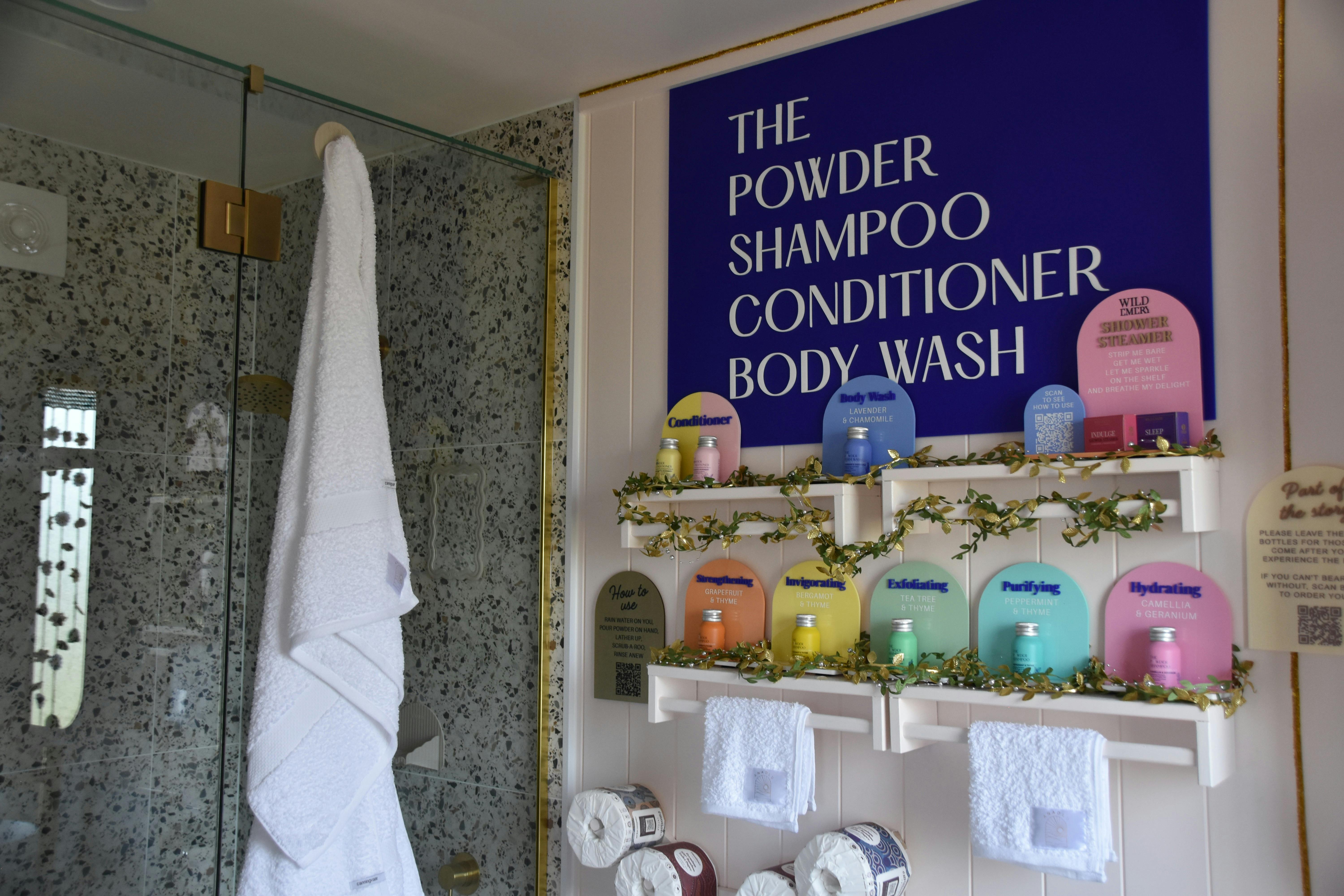 Ensuite bathroom with walk-in shower, towels, and toiletries