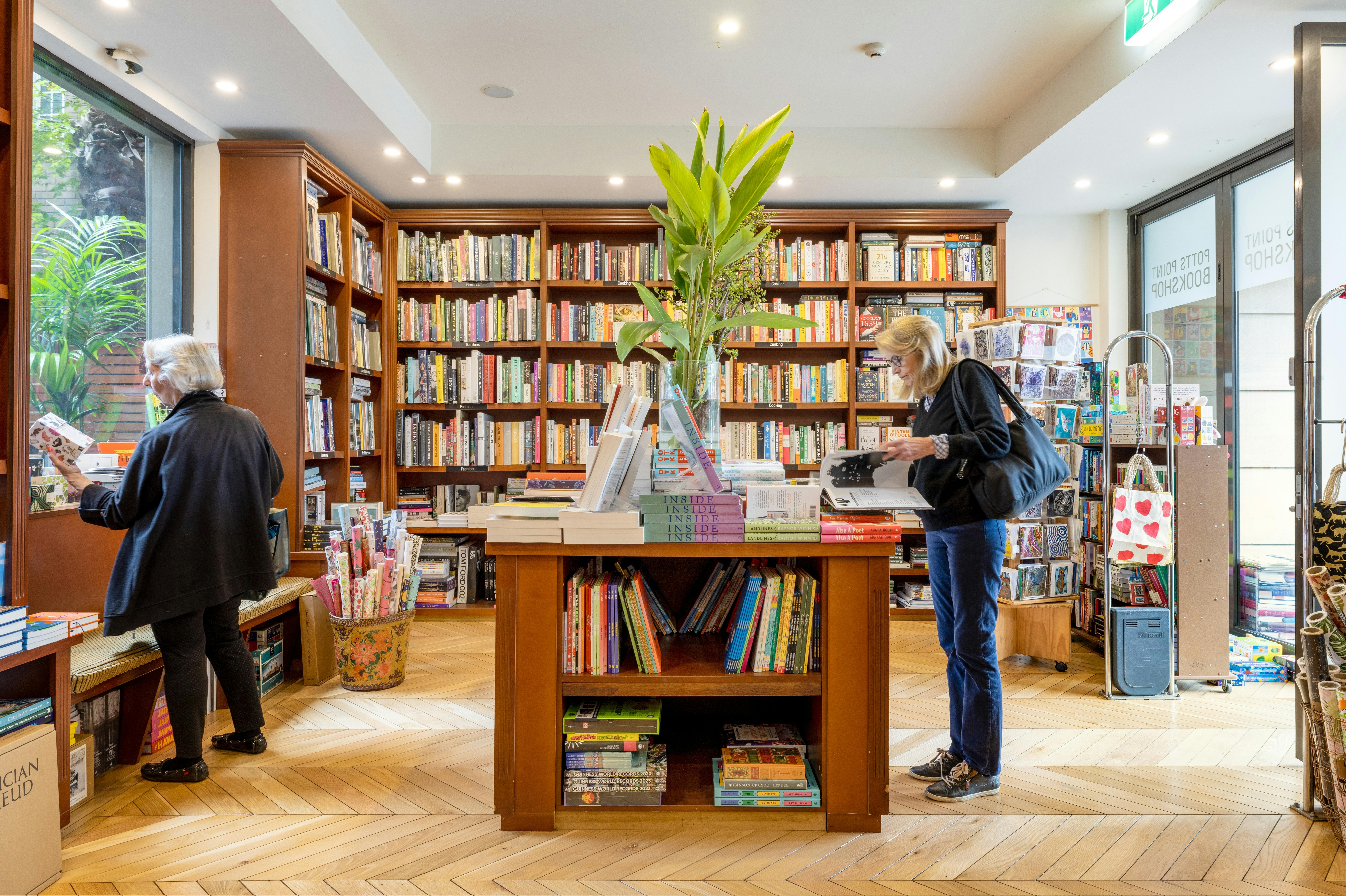 Books piled up on display