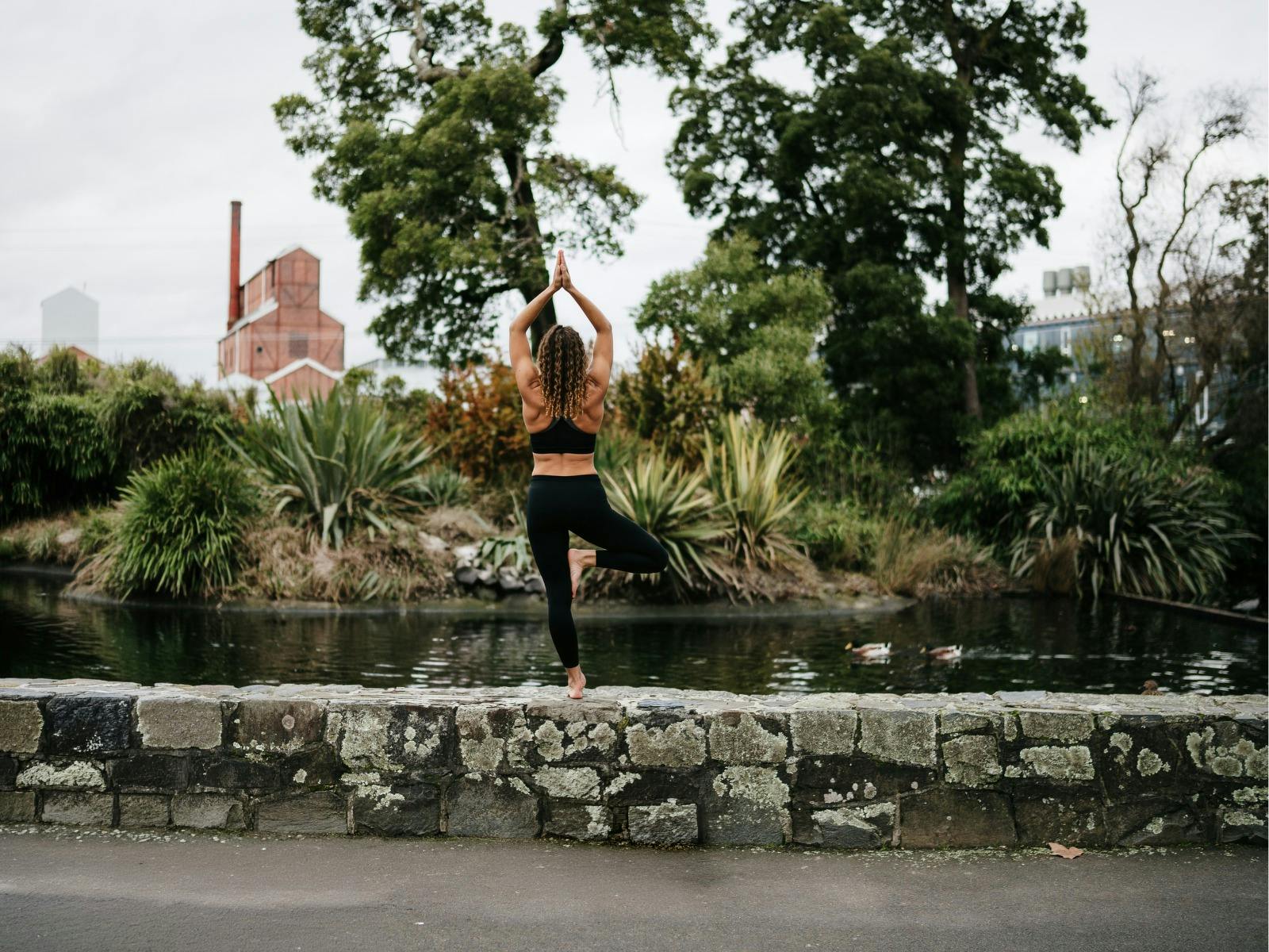 A woman doing yoga outside in Launceston