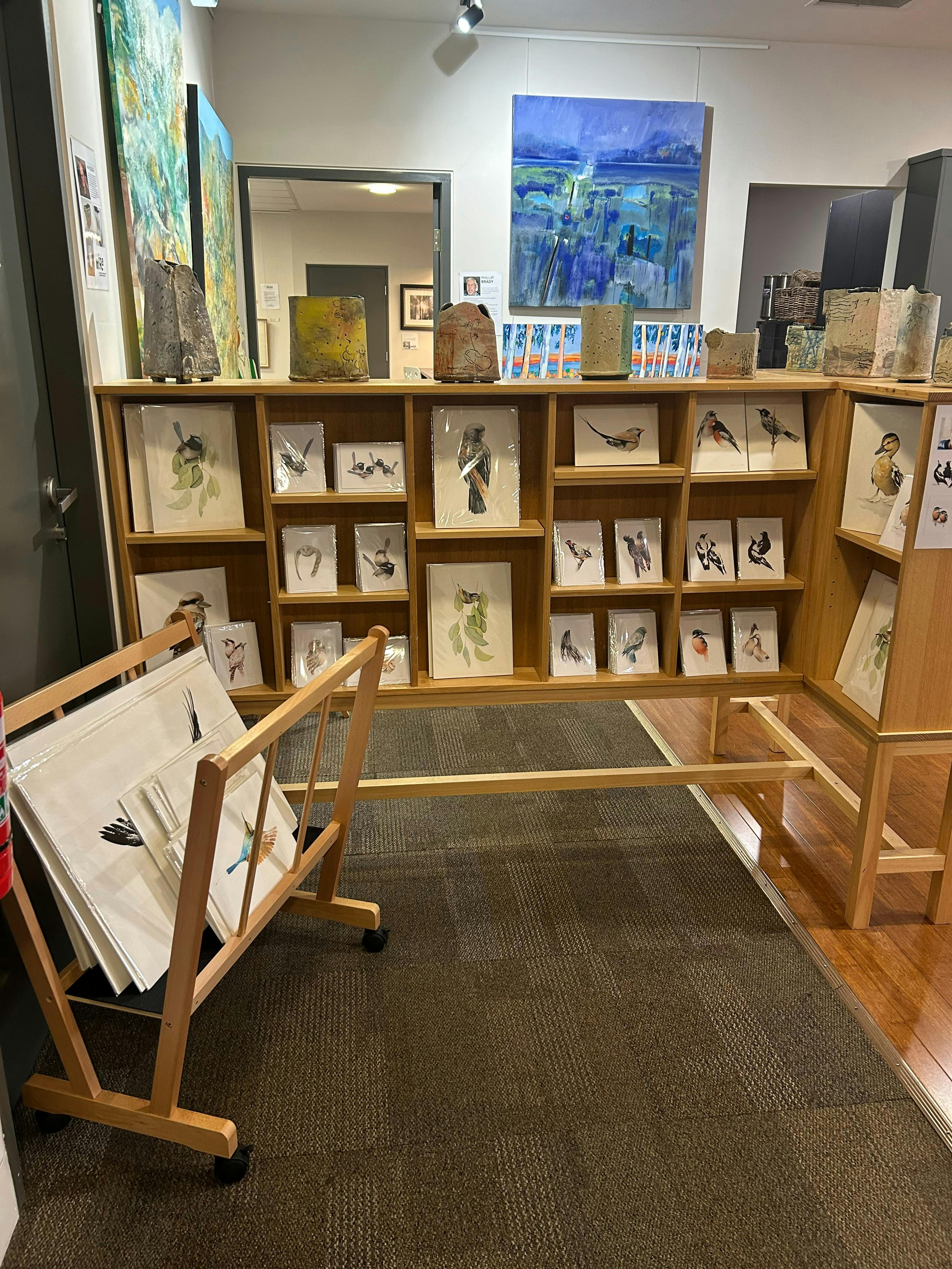 shelves with art prints and cards