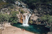 A couple visit Emerald Creek Falls in Mareeba, Tropical North Queensland