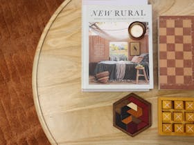 Coffee table set with board games and magazines in the living area.