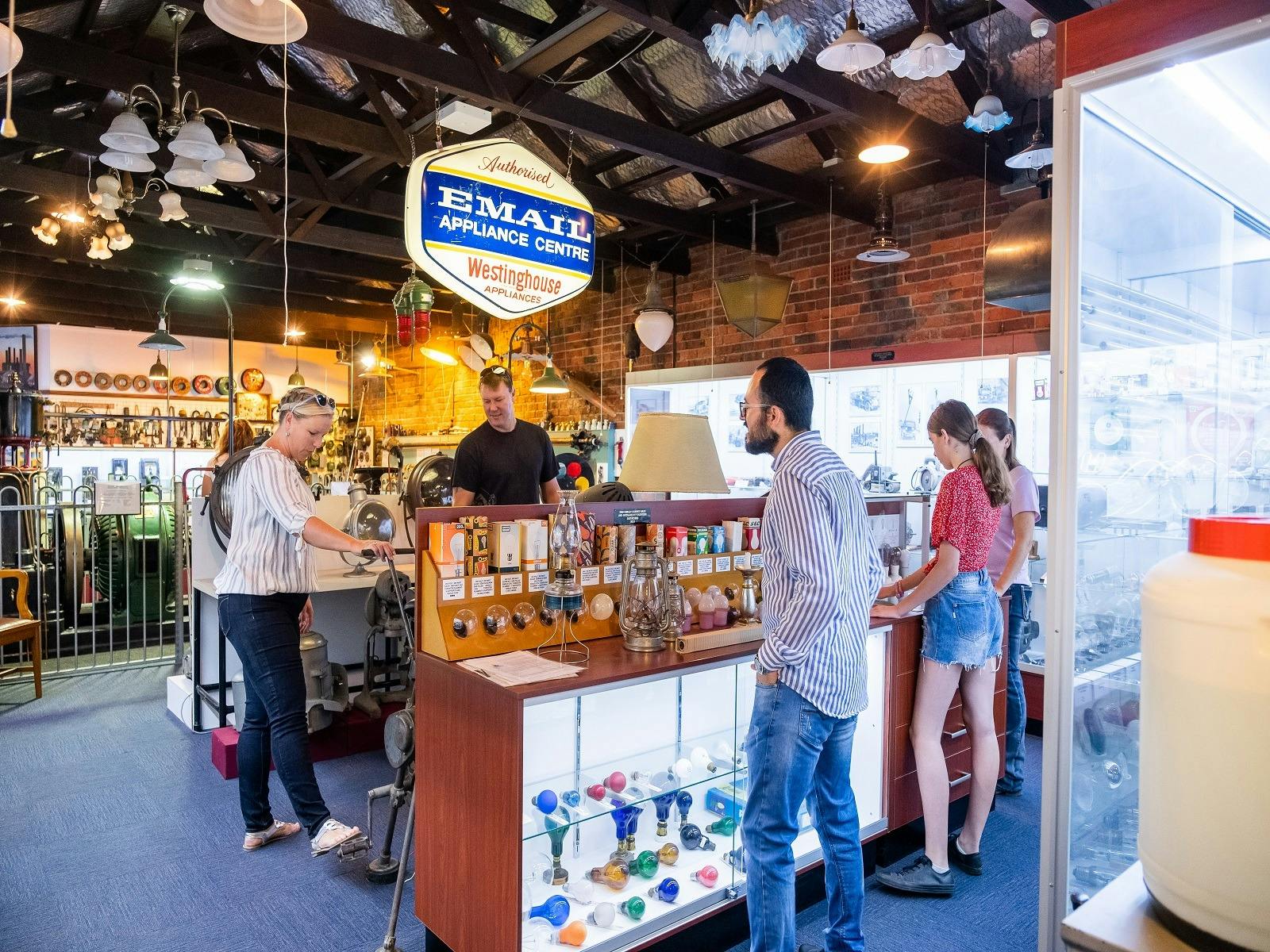 Photo of family admiring some of the old electrical products inside the Powerstation Musuem