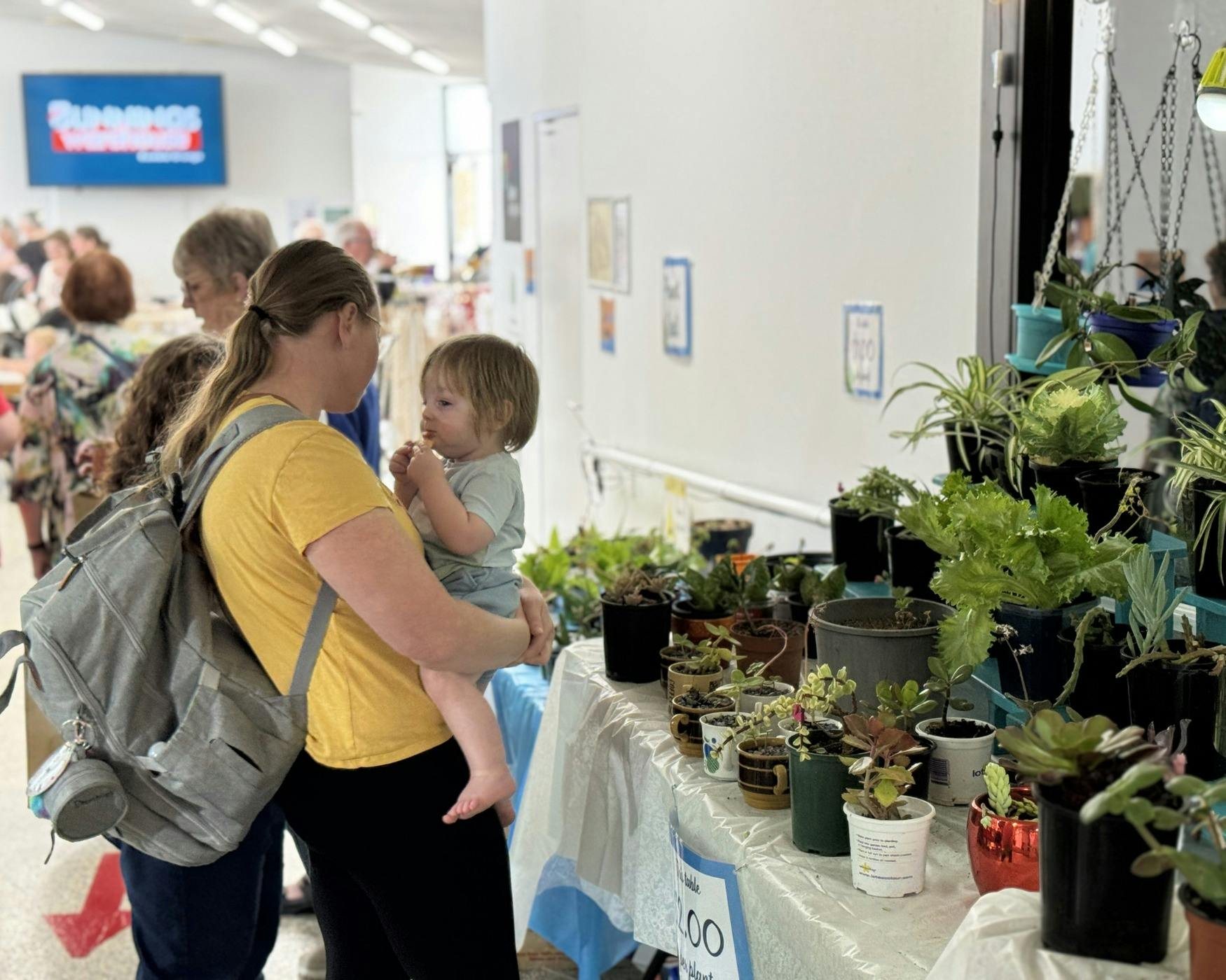 Visitors browsing our plant stall
