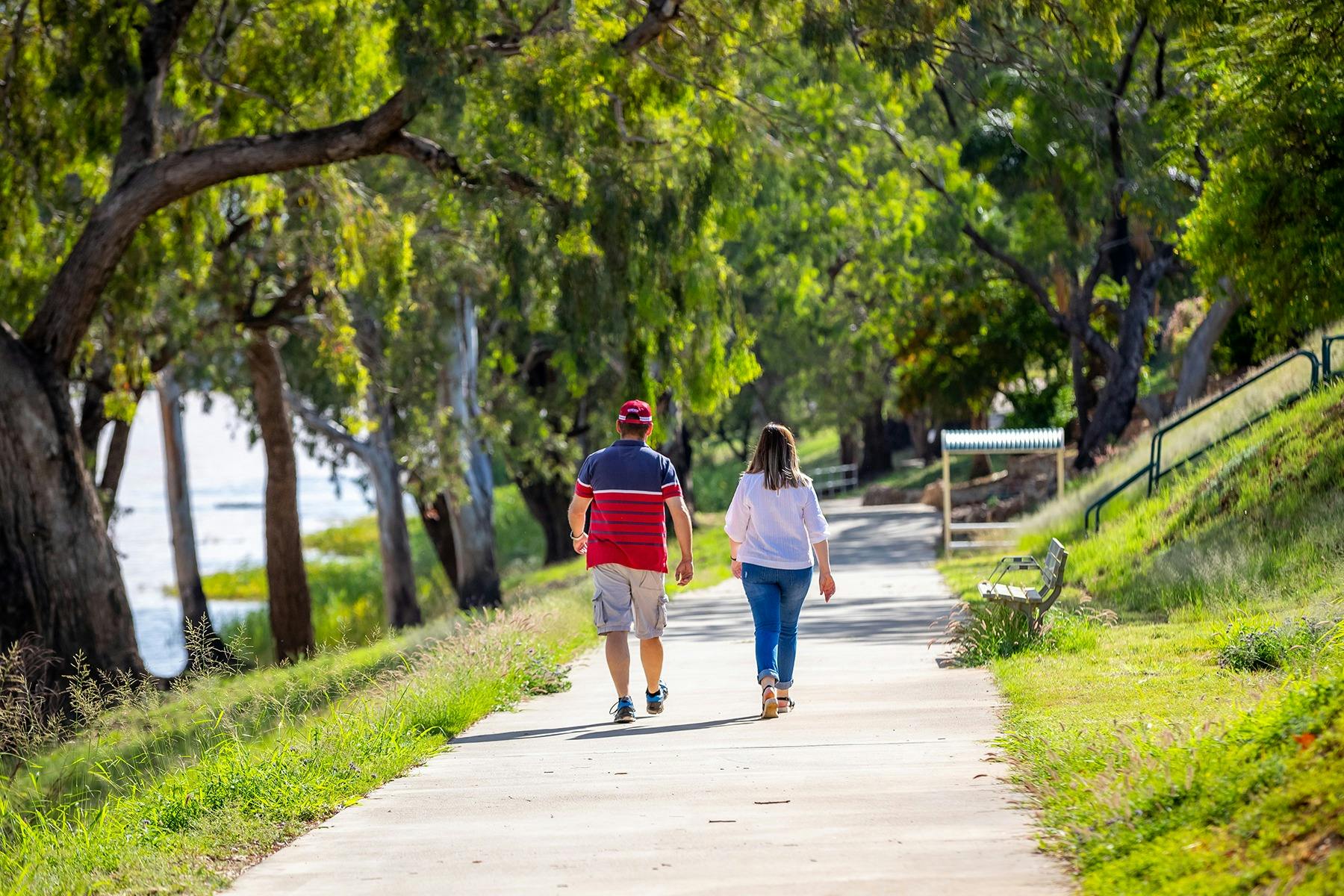 People enjoying the River walkway in St George