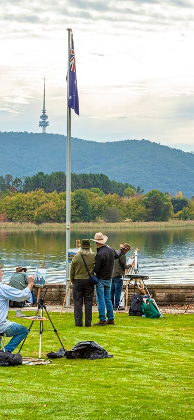 Artists painting on the lawn of Government House overlooking Lake Burley Griffin