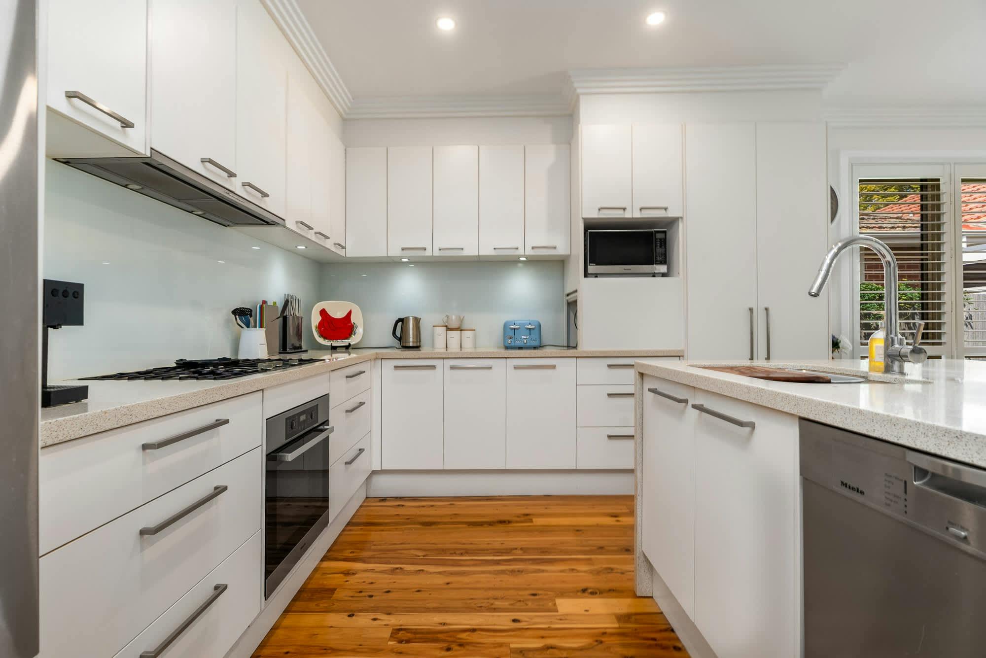 Large open living/kitchen area with all the appliances and amenities.