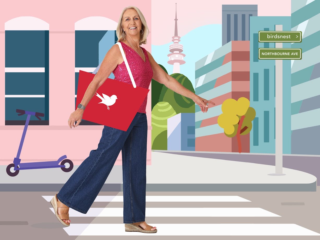 Model Sandy walking through illustrated street scape of Canberra with Northbourne Av sign