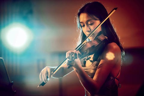 Anna playing a violin