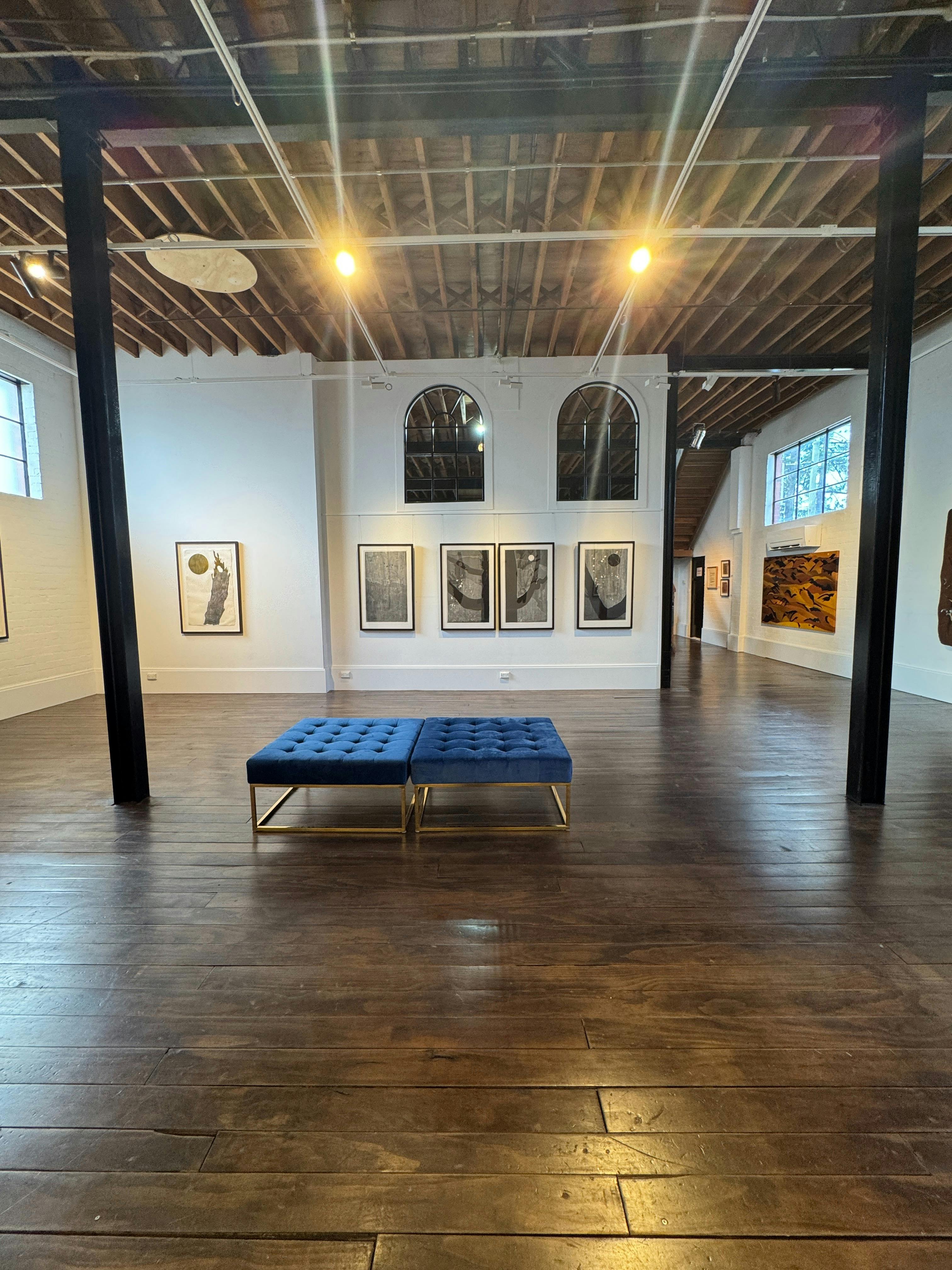gallery with installed lino prints by GW Bot