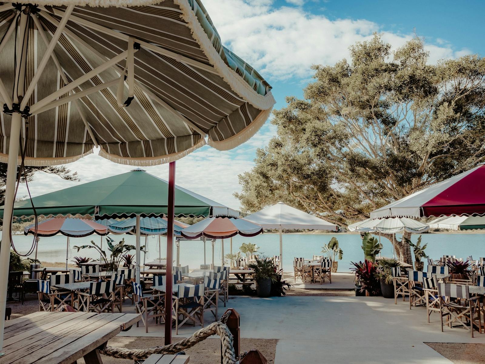 Image of beach umbrellas set over outdoor dining